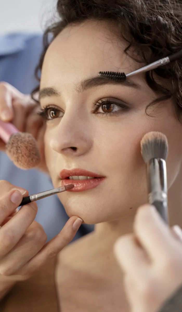 make-up-artist-getting-model-ready-photoshootin-scaled.webp